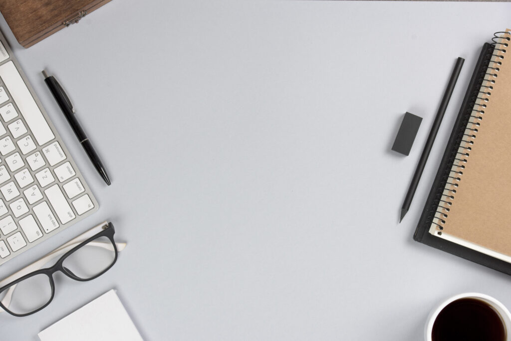 office supplies with keyboard gray desk